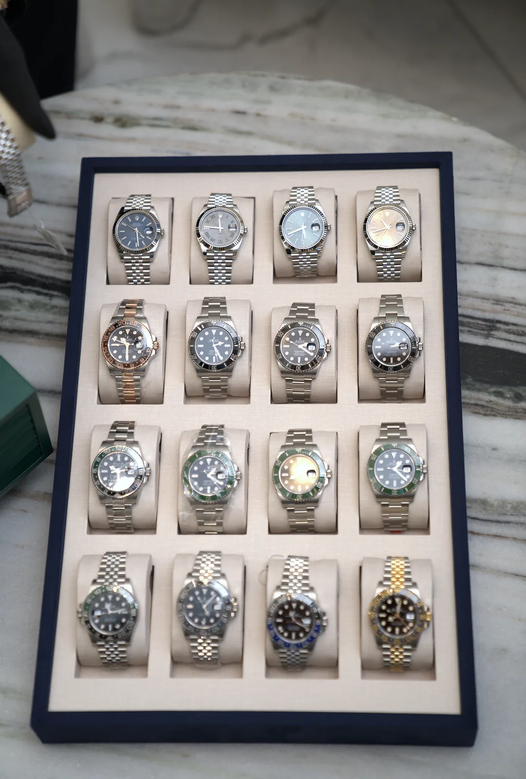 A tray of Rolex watches on the showroom table
